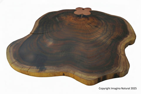 Wooden cutting board with a butterfly design on a white background