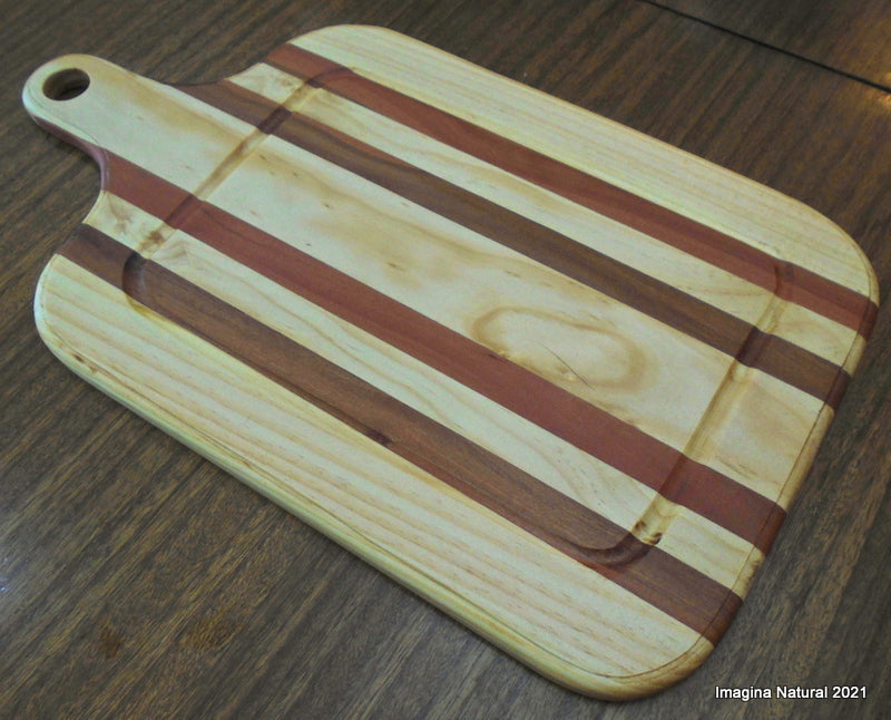 Gorgeous serving board for barbecue made of red rauli wood mixed with pieces of pine wood and sealed with beewax. Free shipping